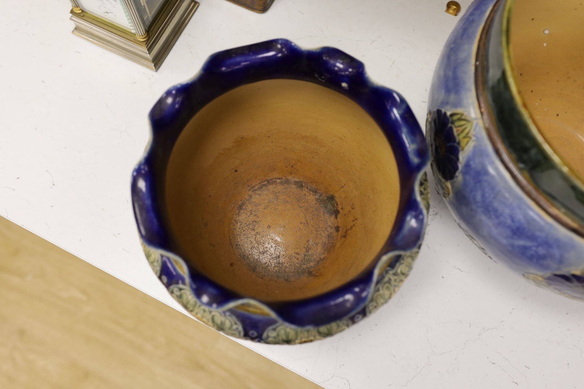 A Royal Doulton blue stoneware jardiniere by Hannah Barlow and another smaller jardiniere by Maude Bowden, largest 29cm in diameter (2). Condition - good